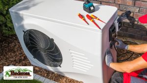 Technician Repairing Heat Pump Unit