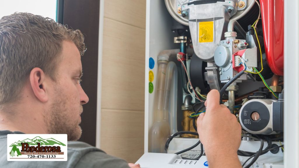 Technician repairing Gas Furnace