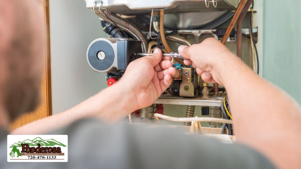 tech repairing Gas Furnace