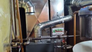 a gas furnace and water heater in a small room