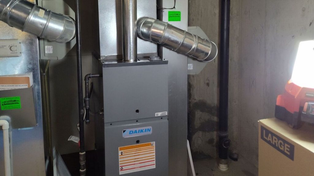 a gas furnace in a room with pipes and other equipment