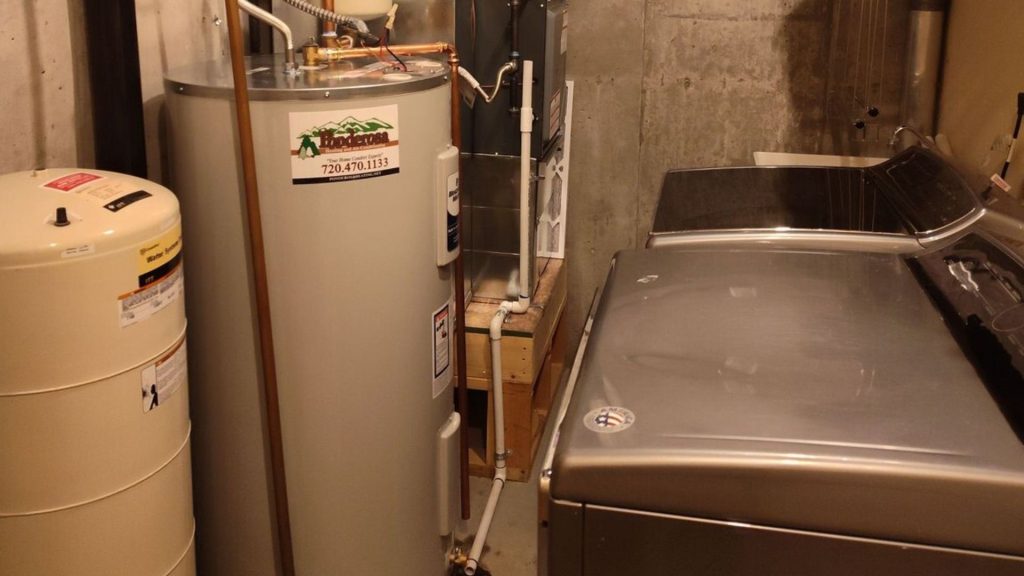 a laundry room with a washer and dryer in it