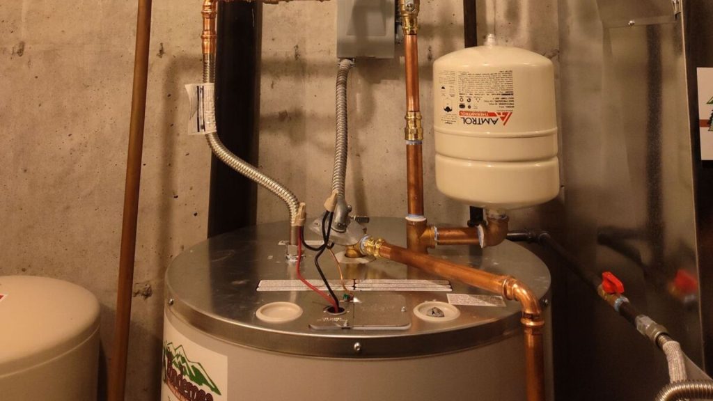 a water heater in a room with pipes and pipes (2)