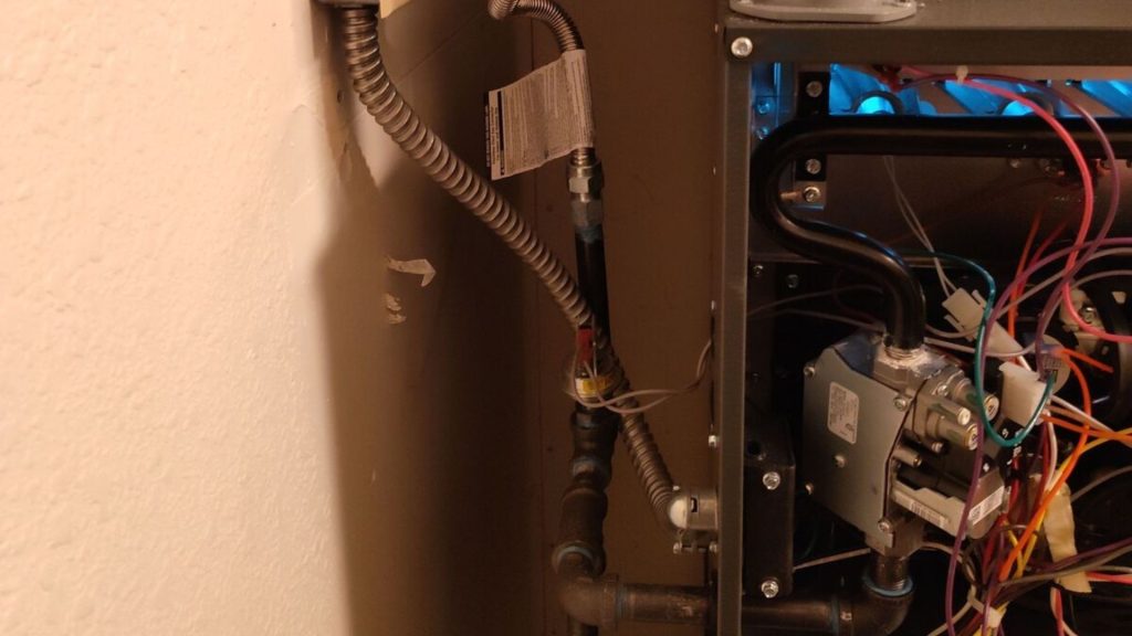 an air conditioner with wires attached to it
