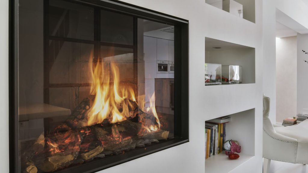a modern fireplace in a white living room