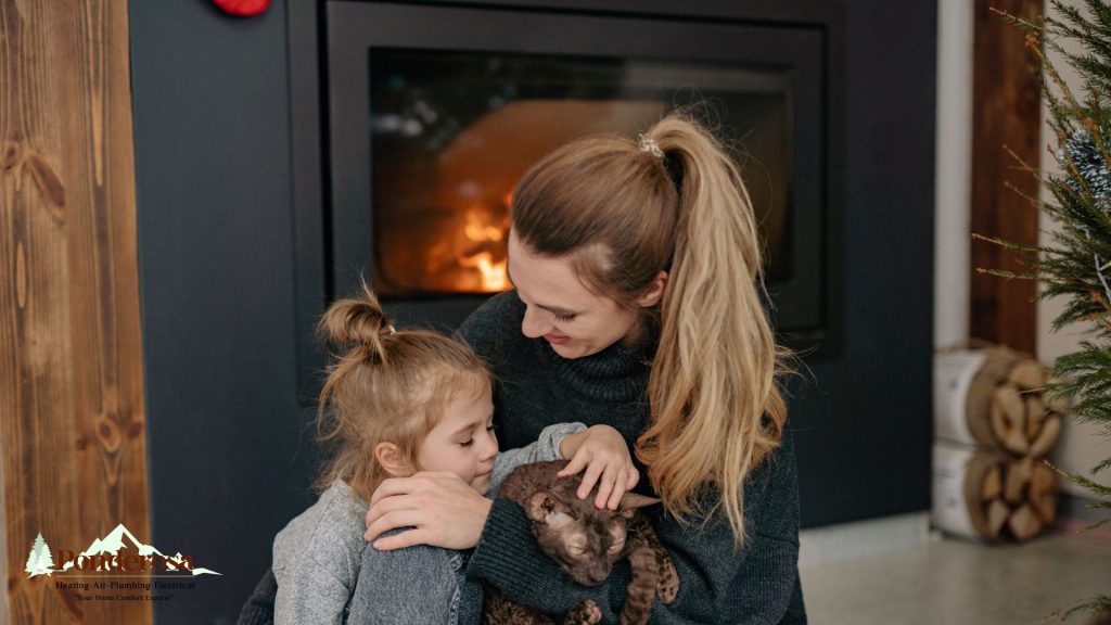 a family and their cat in front of a gas fireplace